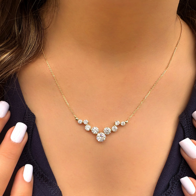 Sparkling yellow gold necklace - Nine zircon stones